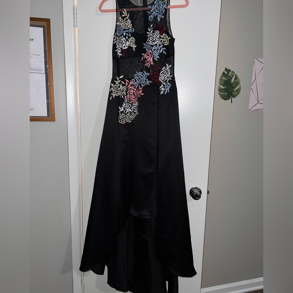 Black high low prom dress with floral design and pockets from Camille la vie